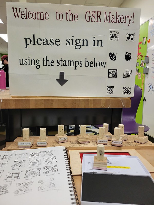 Stamps lined up next to the stamp book at the GSE Makery