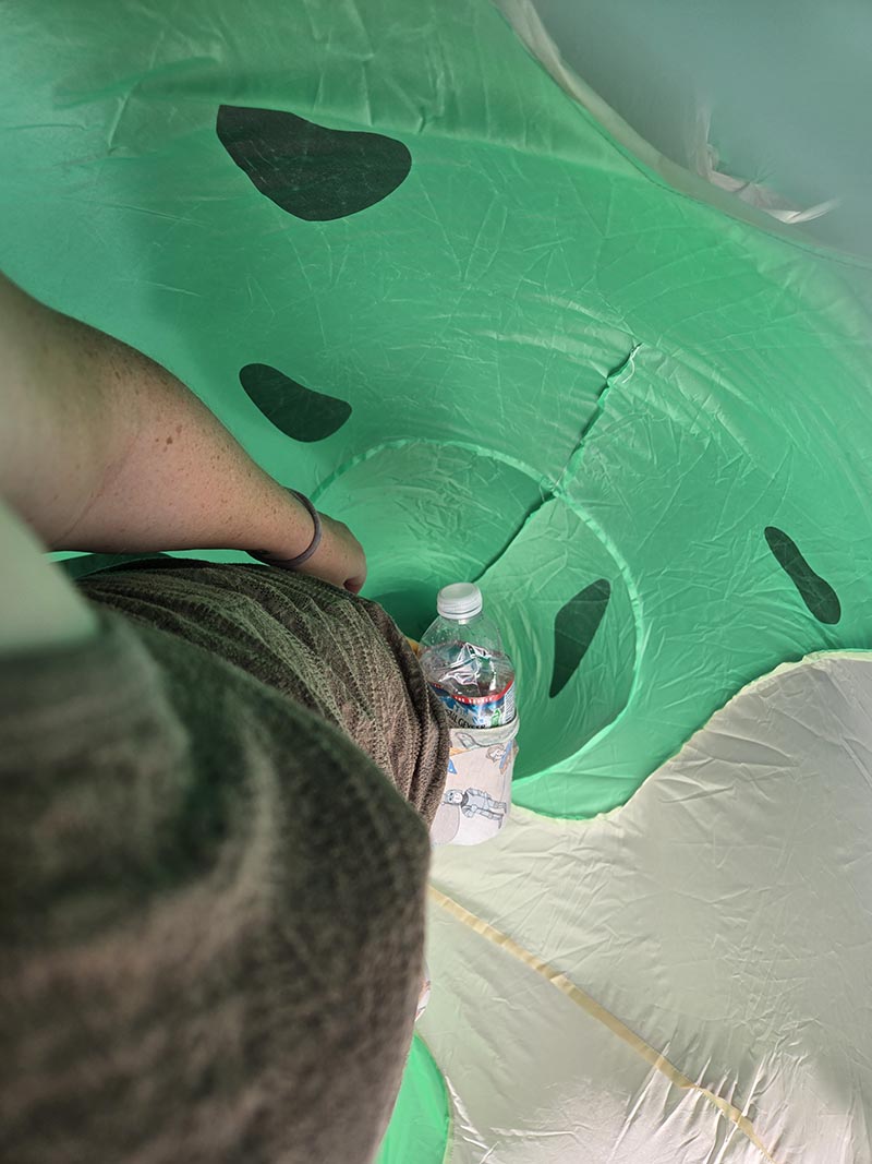 Inside an inflatable frog, looking down
