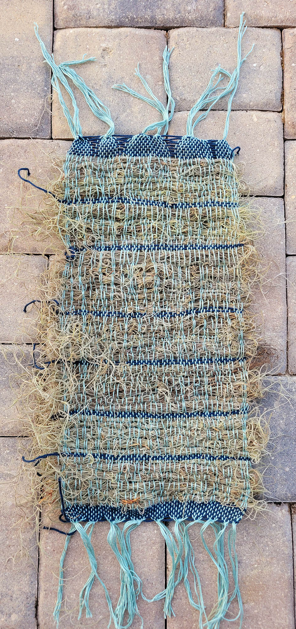 Weaving with weft mostly of Spanish moss