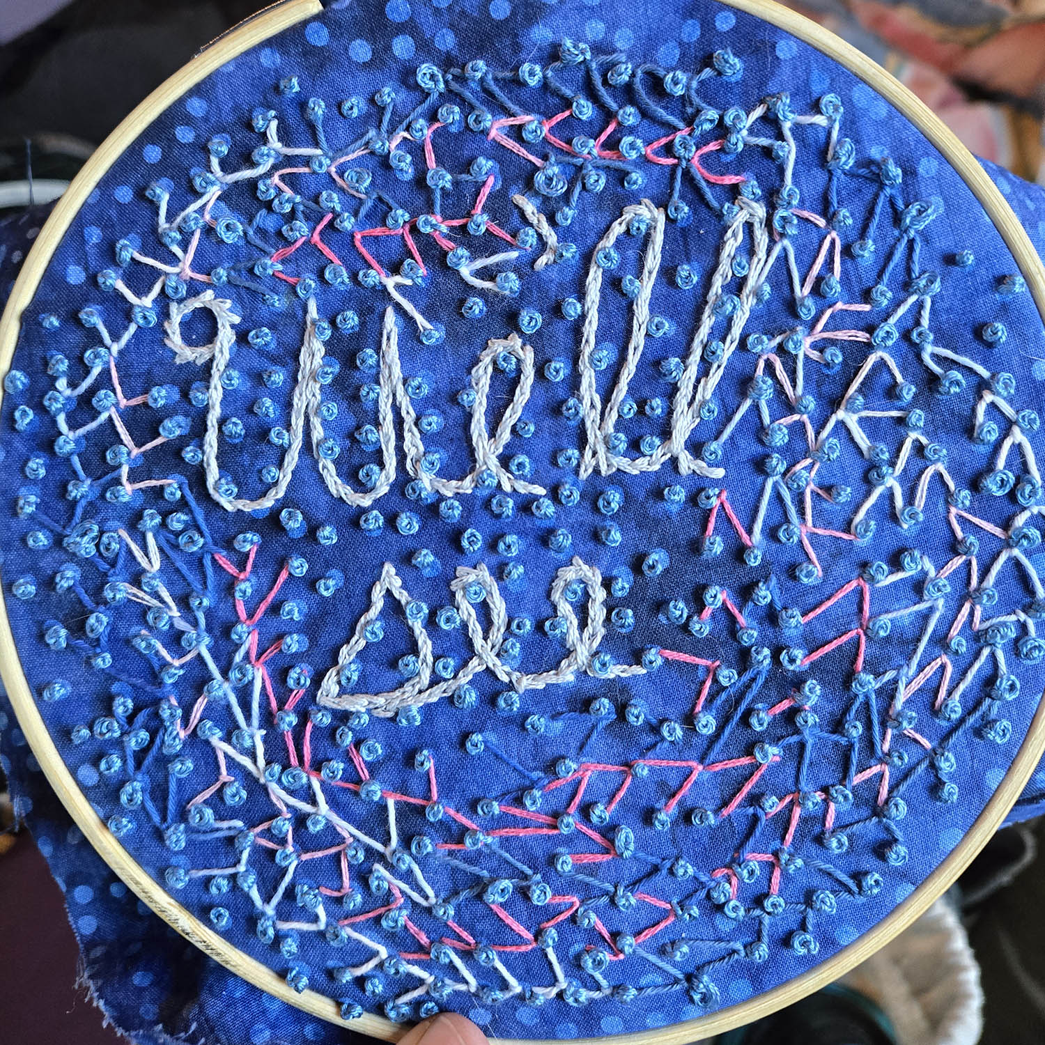 An embroidery that reads "we'll see"